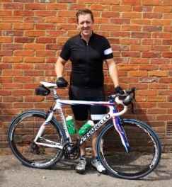 Ashley with bike after another tough training ride