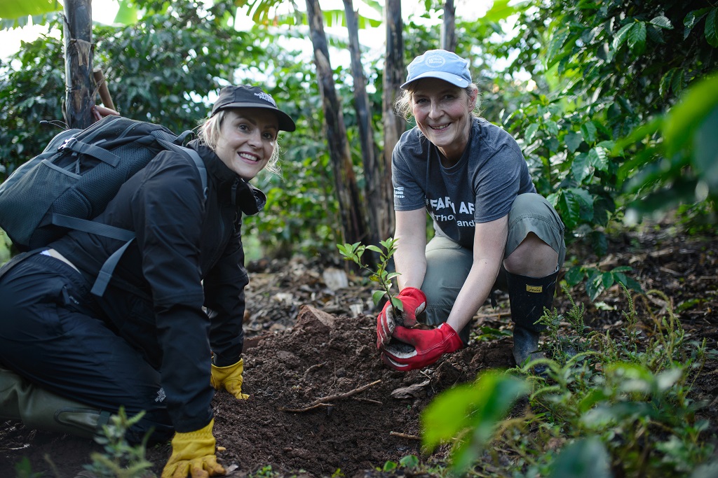 Sarah Louise Fairburn from  L J Fairburn & Son Ltd (left) and Frances Swallow - Finsbury Food Group get to work planting trees as part of The Thousand Trees challenge in Uganda.