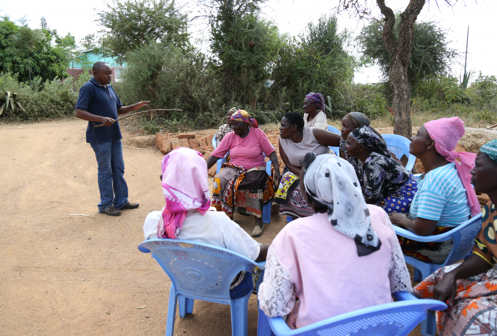 Kathivo women’s group (a VSLA in Kitui, Kenya) at a Farm Africa training session. Farm Africa offers support in setting up the groups, including training skills such as record keeping.