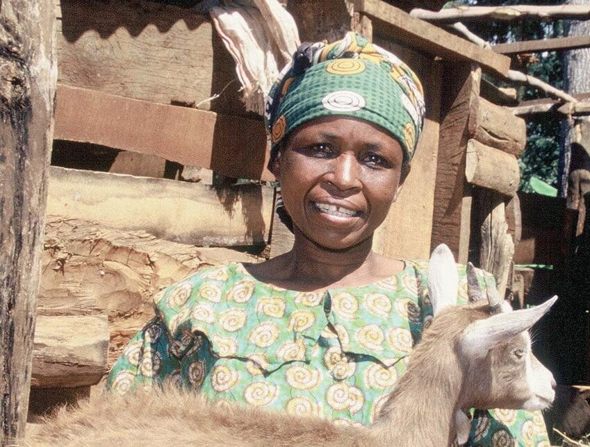 Female farmer, Fabian, and her goat, Kenya.