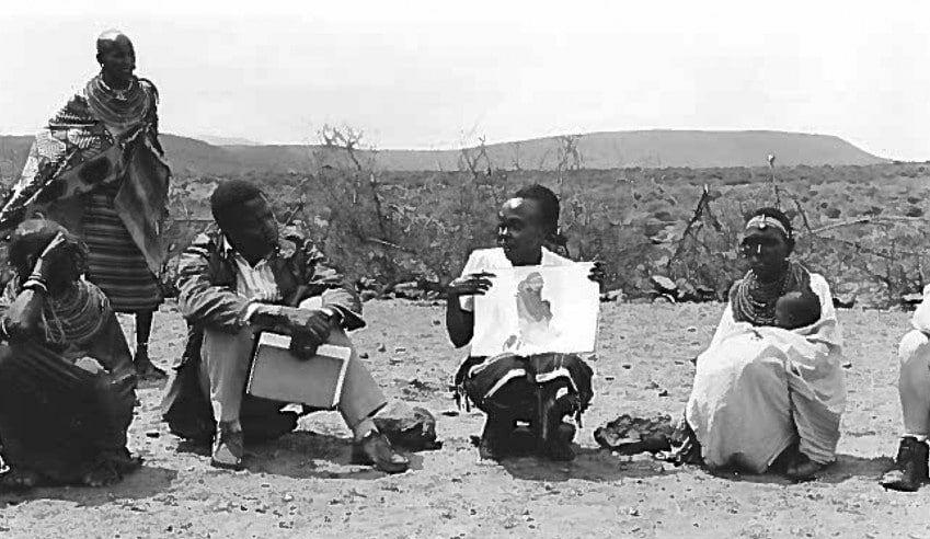 Woman teaching about breastfeeding, Kenya.