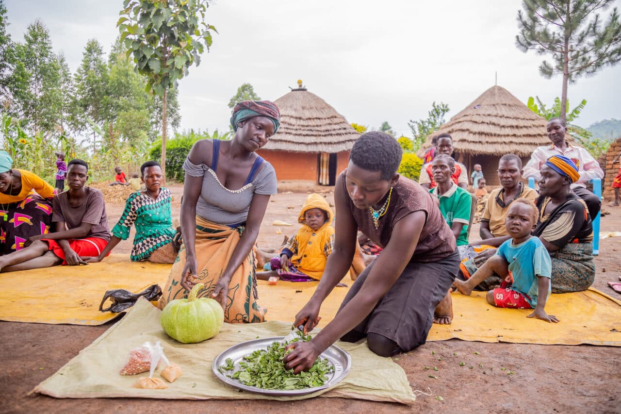 Female farmers in Uganda preparing a healthy meal.
