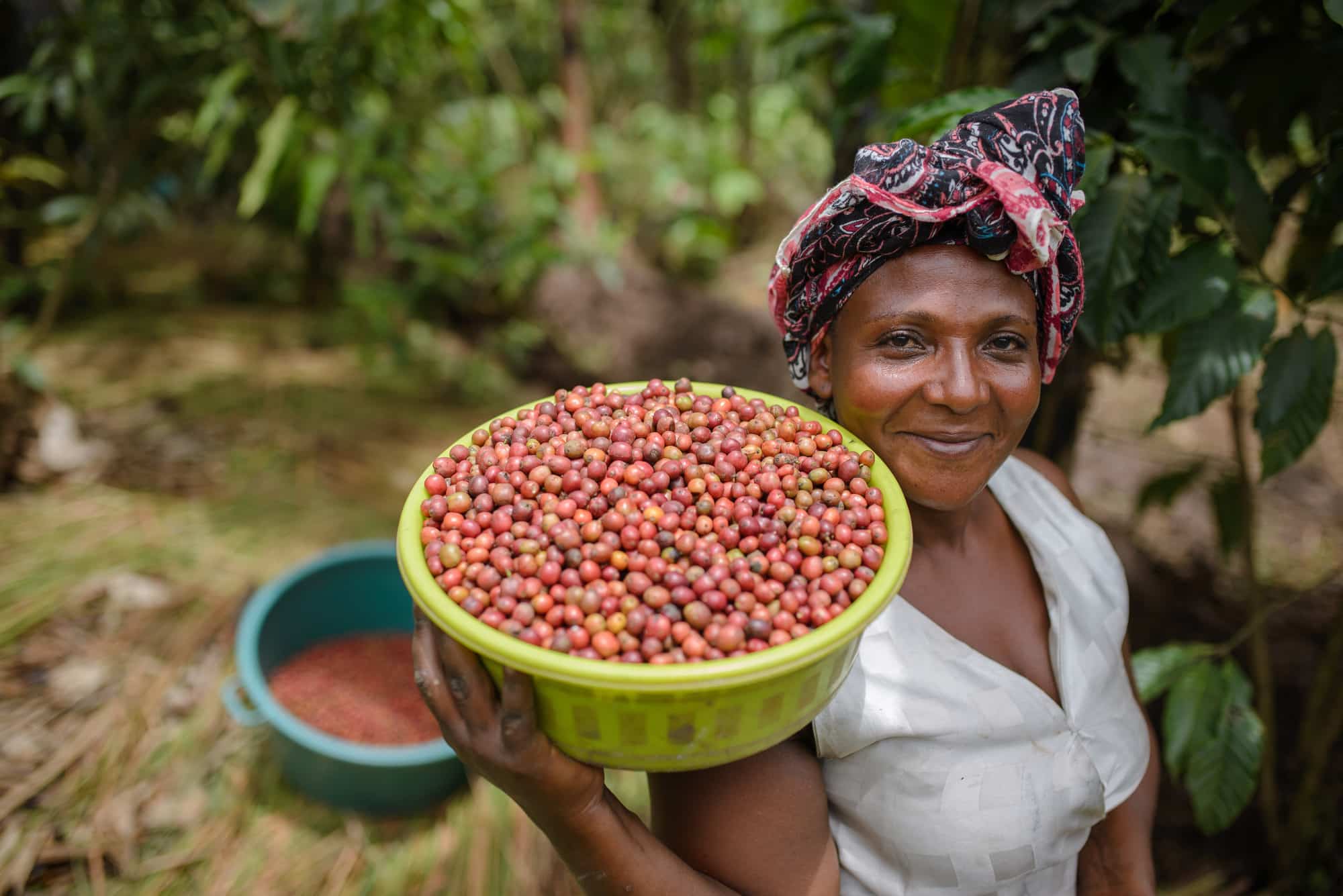 Grace with her healthy, ripe coffee beans.