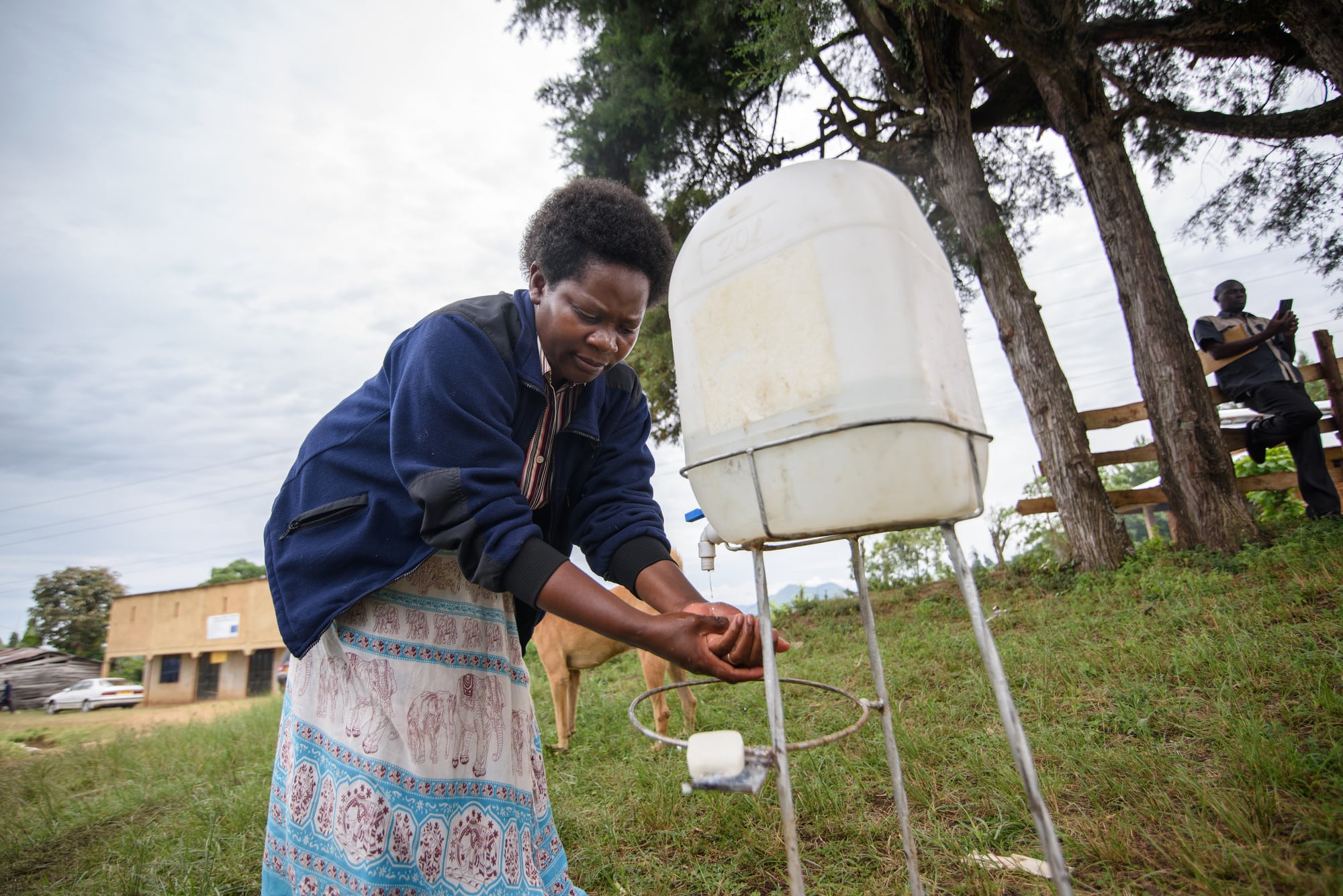 Patience washing her hands after a day of collecting her healthy coffee beans.
