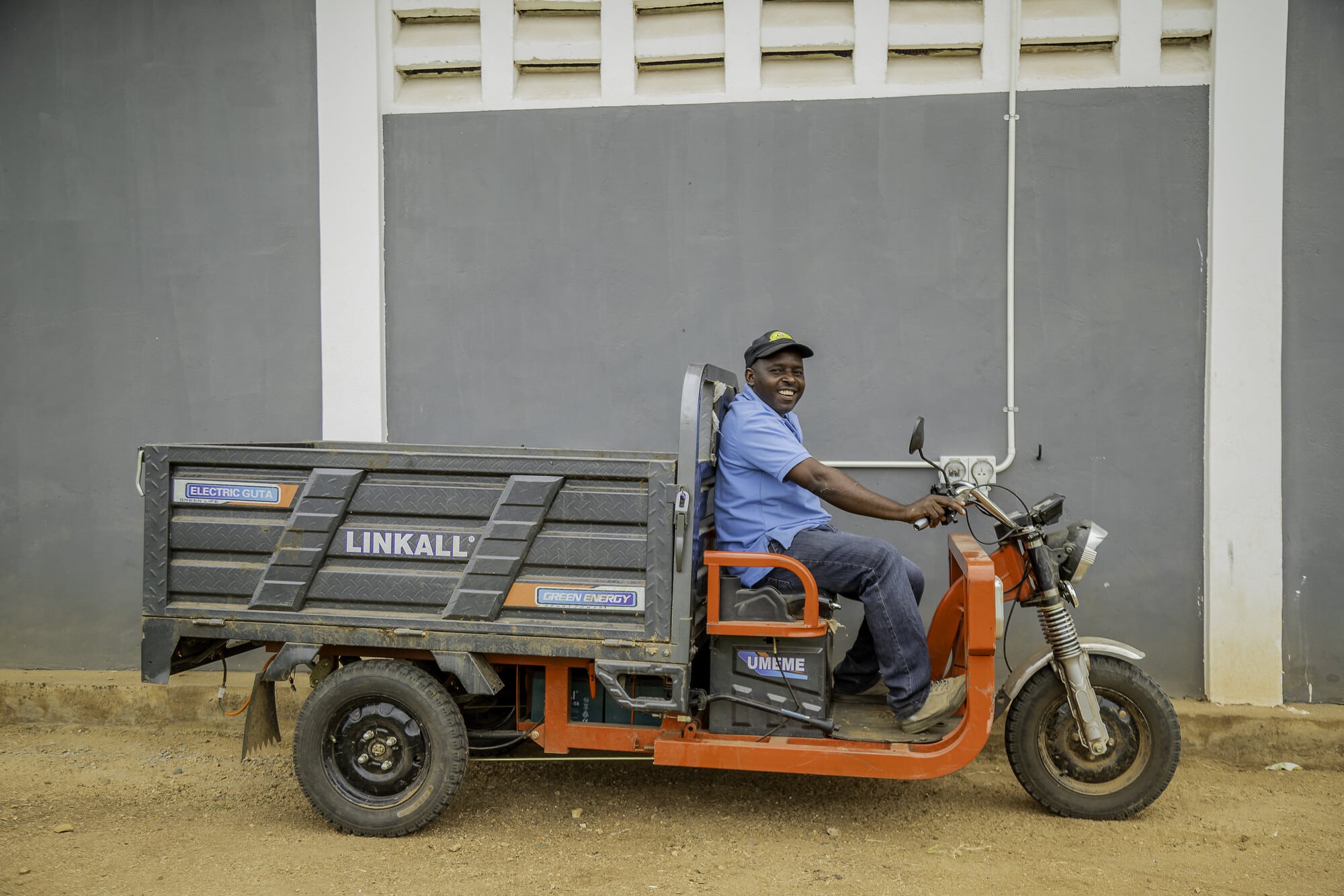 Man sitting on a electric tricycle