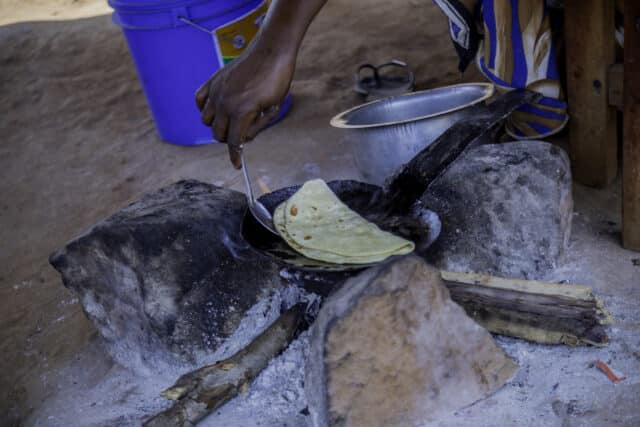 Chapatti cooking in a pan.