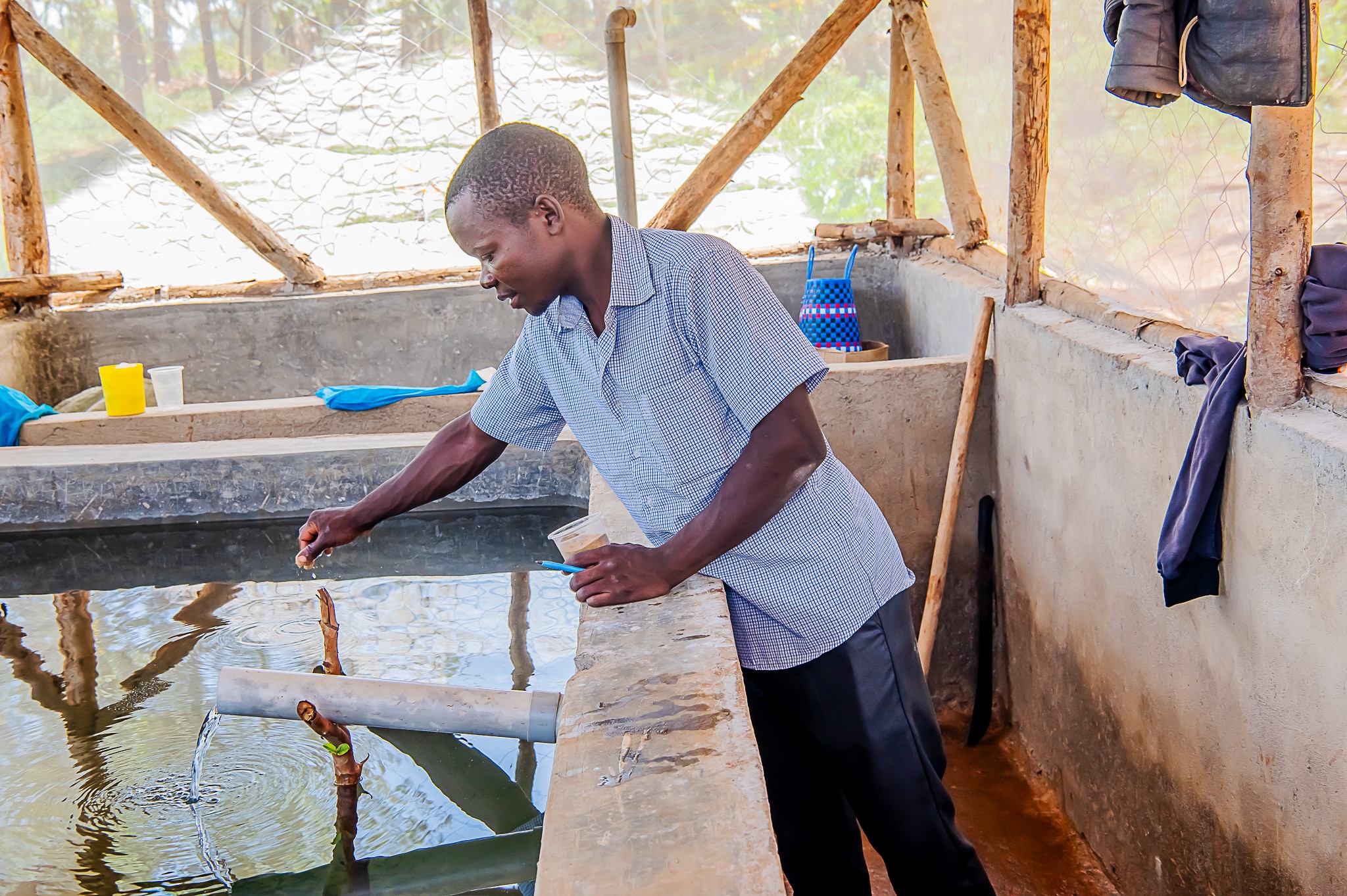 Joseph Sika at his fish farm.