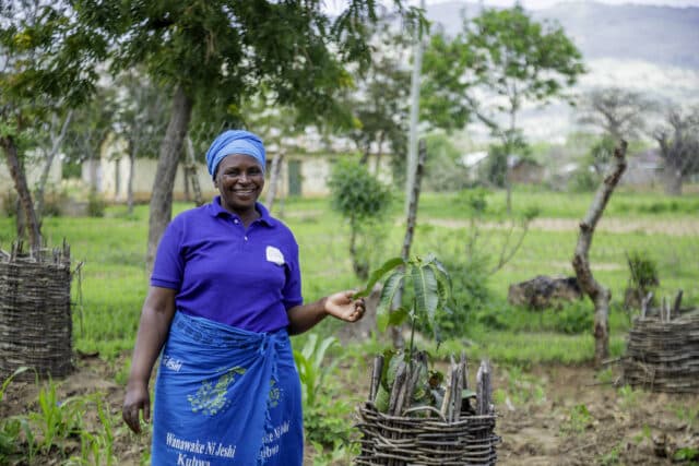 Tanzanian farmer Teluvina in her kitchen garden.