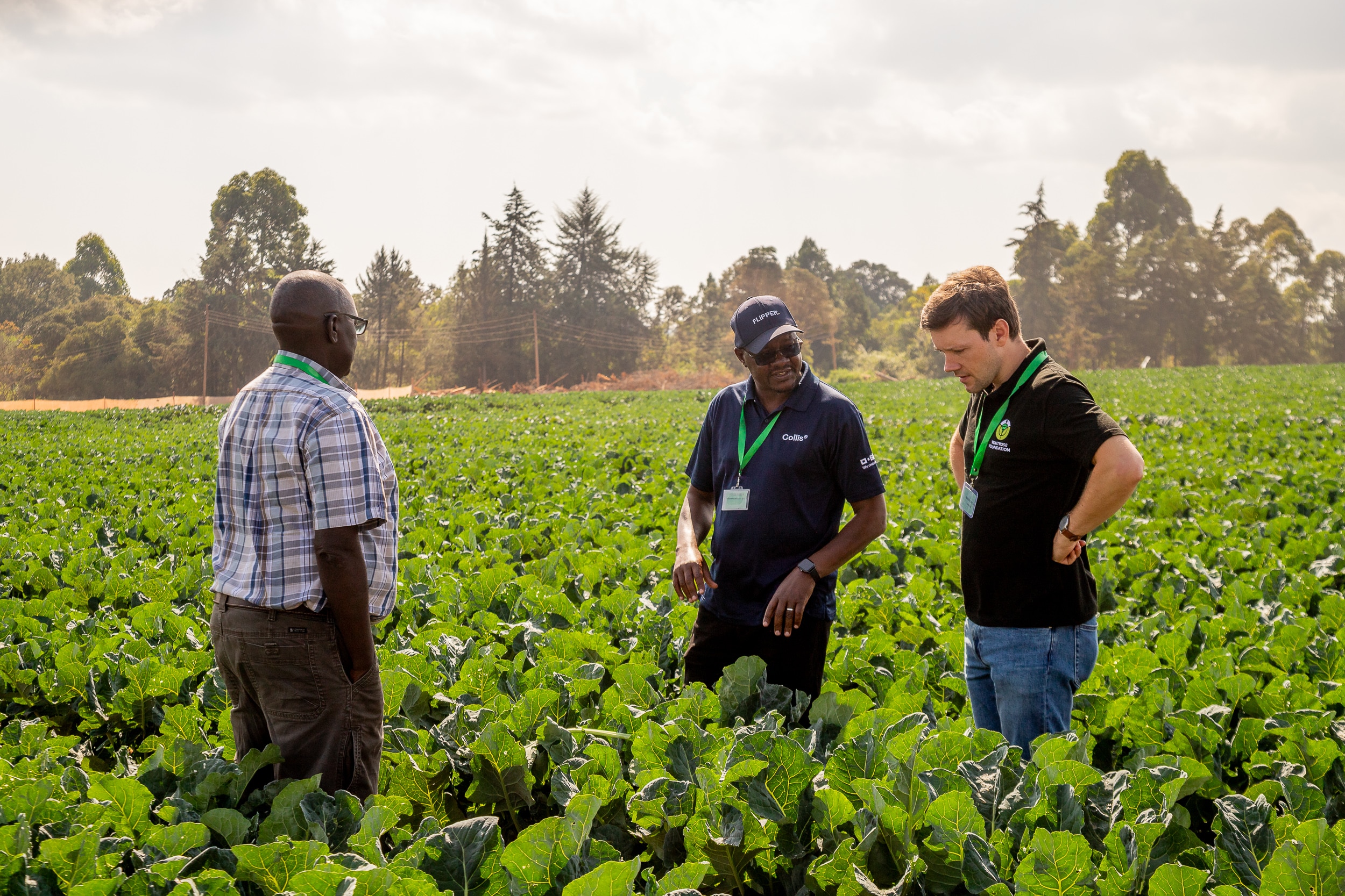 Barney Smyth of the Waitrose Foundation pictured in a field in Kenya with Farm Africa staff.