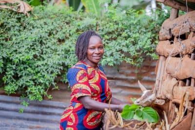 Female farmer Juliet from Embu, Kenya, feeding her goats.